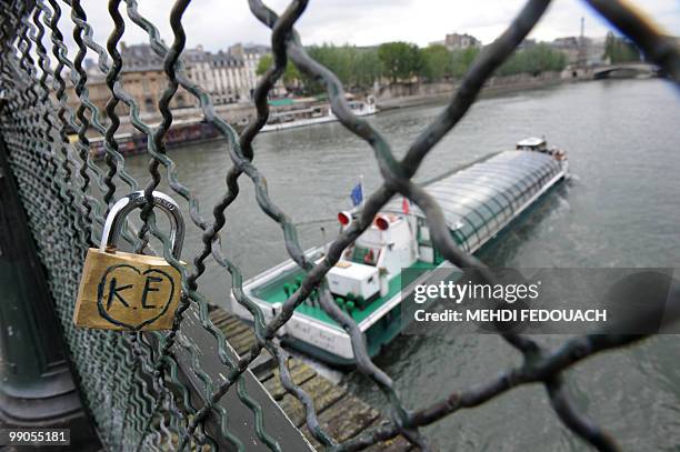 Picture taken on May 12, 2010 on the "Pont des Arts" bridge in Paris shows a "love-lock". More than 1,600 padlocks engraved with hearts and oaths...