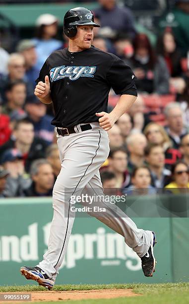 Lyle Overbay of the Toronto Blue Jays scores a run in the fifth inning against the Boston Red Sox on May 12, 2010 at Fenway Park in Boston,...