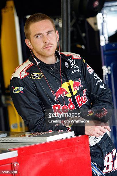 Scott Speed, driver of the Red Bull Toyota, stands in the garage during practice for the NASCAR Sprint Cup Series SHOWTIME Southern 500 at Darlington...