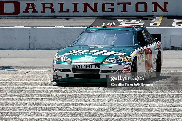 Dale Earnhardt Jr., driver of the AMP Energy / National Guard Chevrolet, drives his car back to the garage during practice for the NASCAR Sprint Cup...