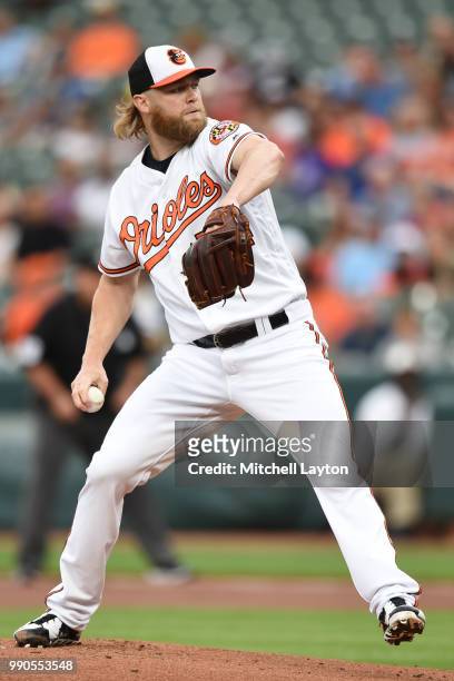 Andrew Cashner of the Baltimore Orioles pitches during a baseball game against the Seattle Mariners at Oriole Park at Camden Yards on June 25, 2018...