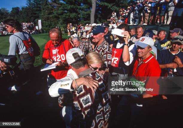26th: Ben Crenshaw, captain of the USA team hugs his wife Julie after his team wins the Ryder Cup at The Country Club in Brookline, Massachusetts on...