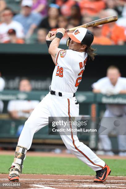 Colby Rasmus of the Baltimore Orioles takes a swing during a baseball game against the Seattle Mariners at Oriole Park at Camden Yards on June 25,...