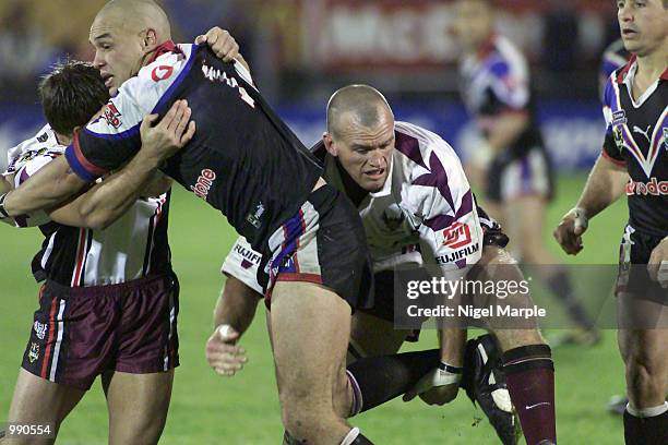 Awen Guttenbeil of the Warriors is tackled by Ben Walker and Adam Muir of the Eagles during the round 15 NRL match between the New Zealand Warriors...