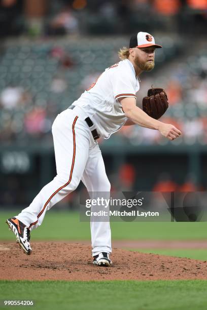 Andrew Cashner of the Baltimore Orioles pitches during a baseball game against the Seattle Mariners at Oriole Park at Camden Yards on June 25, 2018...