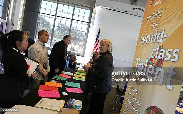 Recruiter from Office Max talks with job seekers during a job fair held by the California Employment Development Department and the San Francisco...