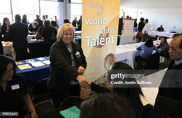 Recruiter from Office Max talks with job seekers during a job fair held by the California Employment Development Department and the San Francisco...