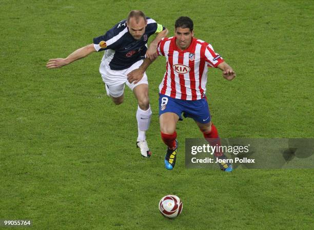 Raul Garcia of Atletico Madrid and Danny Murphy of Fulham battle for the ball during the UEFA Europa League final match between Atletico Madrid and...