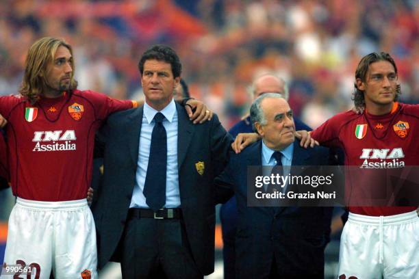 Gabriel Batistuta, coach Fabio Capello, president Franco Sensi and captain Francesco Totti of Roma celebrate their league title at the pre-season...