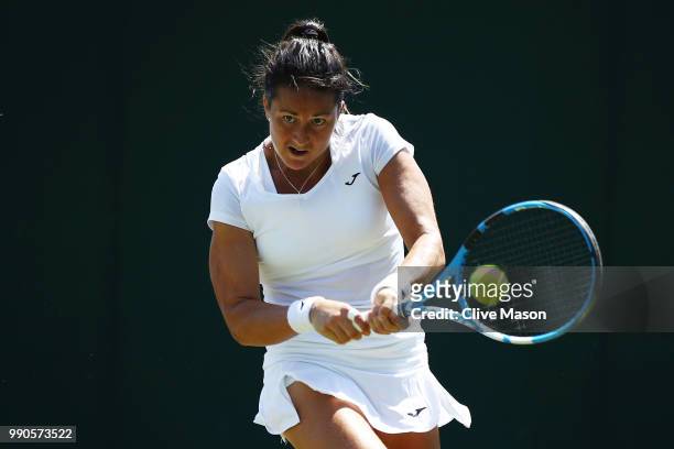 Lara Arruabarrena of Spain returns against Ana Bogdan of Romania during their Ladies' Singles first round match on day two of the Wimbledon Lawn...