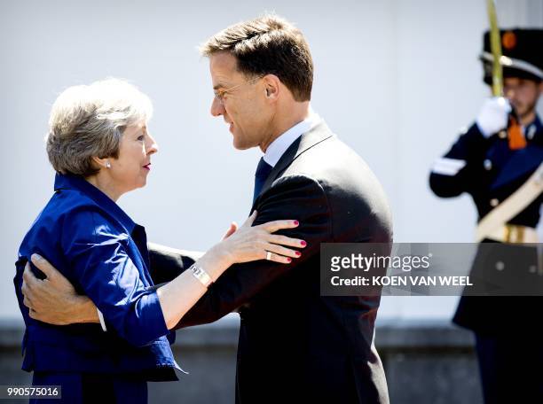 Dutch Prime Minister Mark Rutte welcomes his British counterpart Theresa May for a work lunch at the Catshuis, The Hague, on July 3, 2018. - The two...