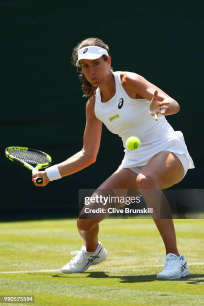 Johanna Konta of Great Britain returns against Natalia Vikhlyantseva of Russia during their Ladies' Singles first round match on day two of the...