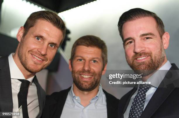 Former German national soccer players Sebastian Kehl , Thomas Hitzlsperger and Christoph Metzelder stand together at the German Football League New...