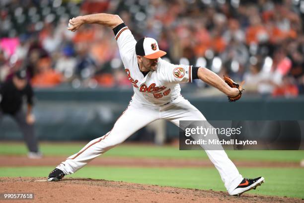 Darren O'Day of the Baltimore Orioles pitches during a baseball game against the Seattle Mariners at Oriole Park at Camden Yards on June 25, 2018 in...