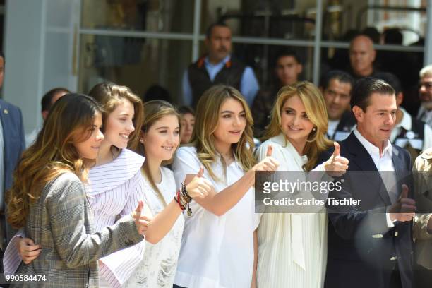 Sofia Castro, Angelica Rivera and President of Mexico Enrique Pena Nieto pose for photos after voting during the Mexico 2018 Presidential Election on...