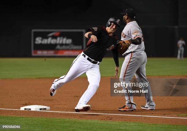 Jake Lamb of the Arizona Diamondbacks rounds third base against the San Francisco Giants at Chase Field on June 30, 2018 in Phoenix, Arizona.