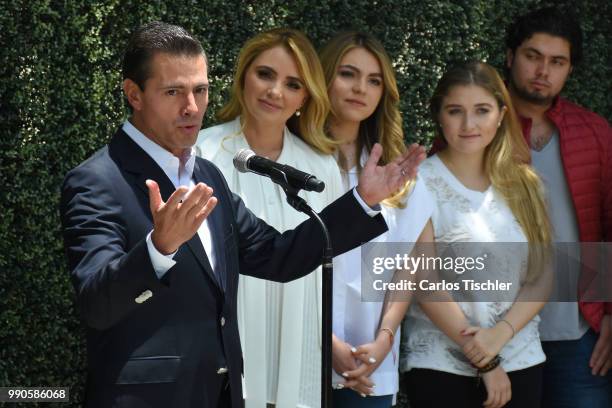 President of Mexico Enrique Pena Nieto speaks next of his family after voting during the Mexico 2018 Presidential Election on July 1, 2018 in Mexico...