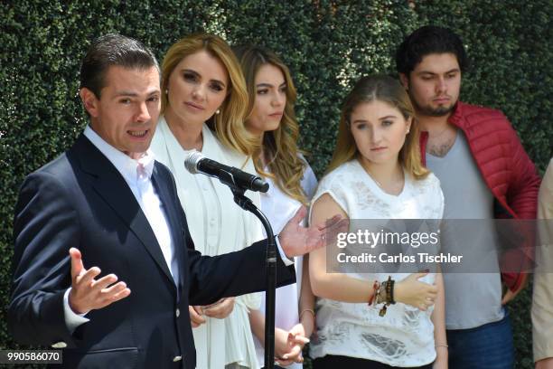 President of Mexico Enrique Pena Nieto speaks next of his family after voting during the Mexico 2018 Presidential Election on July 1, 2018 in Mexico...