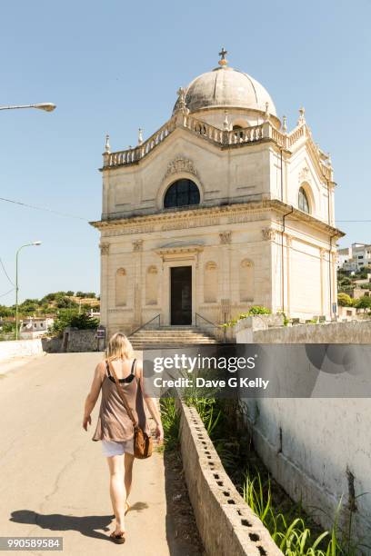 rear view of woman walking towards a church - the dome 55 stock pictures, royalty-free photos & images