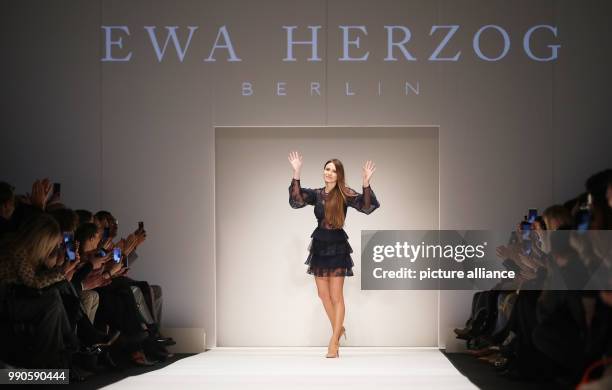 The fashion designer Ewa Herzog walks onto the catwalk after the presentation of her collection during Fashion Week in Berlin, Germany, 16 January...