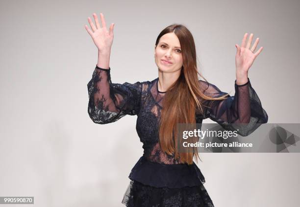 The fashion designer Ewa Herzog walks onto the catwalk after the presentation of her collection during Fashion Week in Berlin, Germany, 16 January...