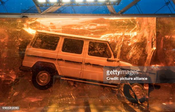 Vehicle of the new G-Class by Mercedes is cast in acrylic glass in front of the NAIAS entrance at the Detroit Auto Show in Detroit, US, 16 January...