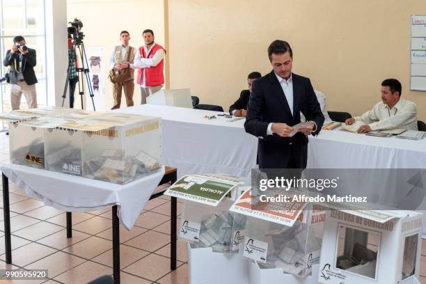 Mexican President Enrique Peña Nieto casts his vote in polling station at El Pipila School during the 2018 Presidential Elections in Mexico City on...