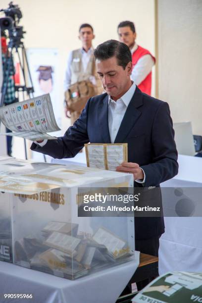 Mexican President Enrique Peña Nieto casts his vote in polling station at El Pipila School during the 2018 Presidential Elections in Mexico City on...