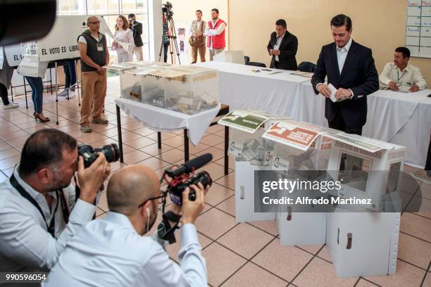 Mexican President Enrique Peña Nieto casts his vote in polling station at El Pipila School during the 2018 Presidential Elections in Mexico City on...