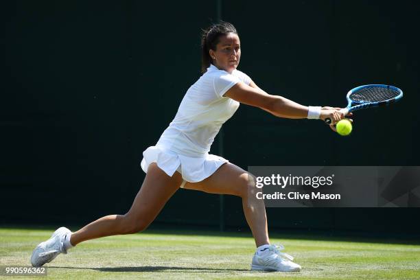 Lara Arruabarrena of Spain returns against Ana Bogdan of Romania during their Ladies' Singles first round match on day two of the Wimbledon Lawn...