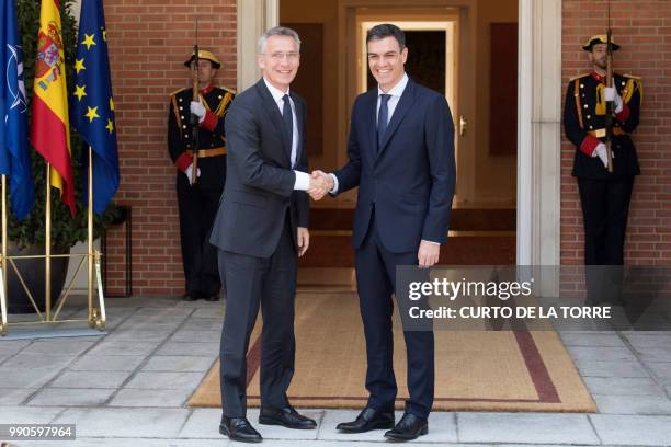 Spanish Prime Minister Pedro Sanchez welcomes NATO General Secretary Jens Stoltenberg at the Moncloa palace in Madrid on July 3, 2018.