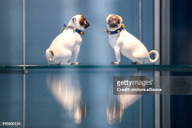 February 2018, Germany, Duesseldorf: Two pugs made of Meissener porcelain, created by Johann Joachim Kaendler around the year 1740 are on display at...