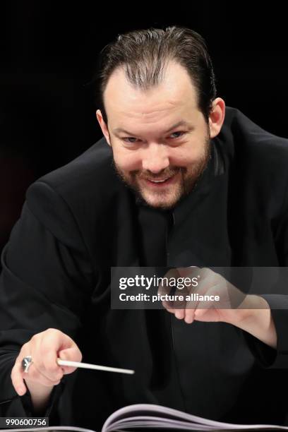 February 2018, Germany, Leipzig: The new music director of the Gewandhaus Leipzig Andris Nelsons conducts during a rehearsal of the Gewandhaus...