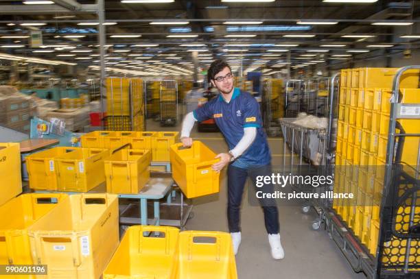 February 2018, Germany, Osterweddingen: Anas Almalla who fled from Damascus, Syria, works at the mail centre of the Deutsche Post . Since 2015, the...