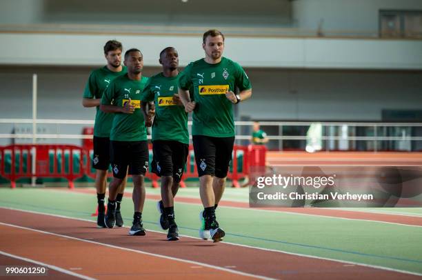 Tony Jantschke, Ibrahima Traore, Raffael and Tobias Strobl run during a lactate test of Borussia Moenchengladbach at Esprit Arena on July 03, 2018 in...