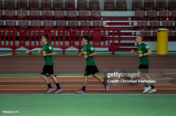 Patrick Herrmann, Jonas Hofmann and Oscar Wendt run during a lactate test of Borussia Moenchengladbach at Esprit Arena on July 03, 2018 in...