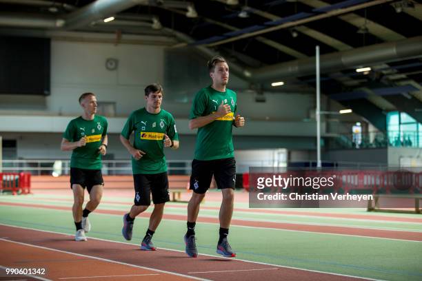 Patrick Herrmann, Jonas Hofmann and Oscar Wendt run during a lactate test of Borussia Moenchengladbach at Esprit Arena on July 03, 2018 in...
