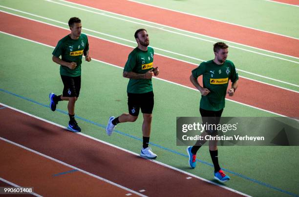 Christoph Kramer, Tobias Sippel and Fabian Johnson run during a lactate test of Borussia Moenchengladbach at Esprit Arena on July 03, 2018 in...