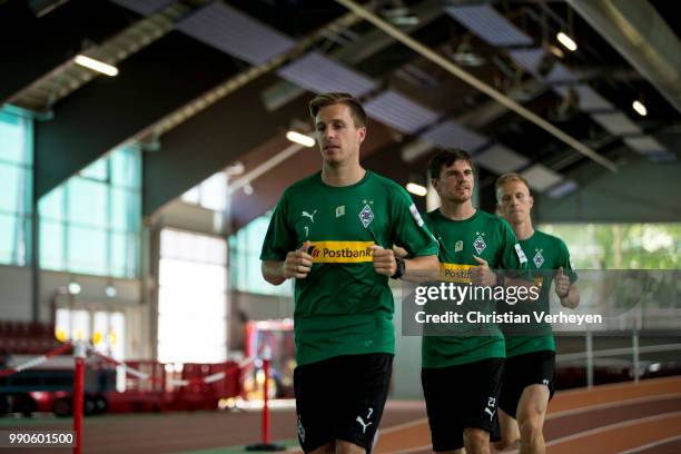 Patrick Herrmann, Jonas Hofmann and Oscar Wendt run during a lactate test of Borussia Moenchengladbach at Esprit Arena on July 03, 2018 in...