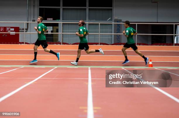 Christoph Kramer, Tobias Sippel and Fabian Johnson run during a lactate test of Borussia Moenchengladbach at Esprit Arena on July 03, 2018 in...