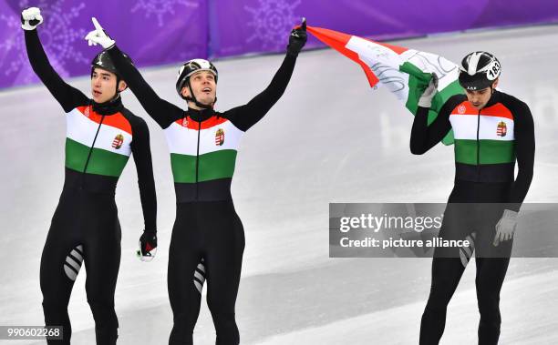 Dpatop - Hungarian gold medallists Viktor Knoch , Shaoang Liu and Csaba Burjan celebrate winning the Men's Short track speed skating 5000 metre relay...