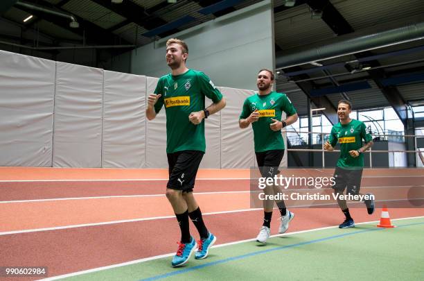 Christoph Kramer, Tobias Sippel and Fabian Johnson run during a lactate test of Borussia Moenchengladbach at Esprit Arena on July 03, 2018 in...