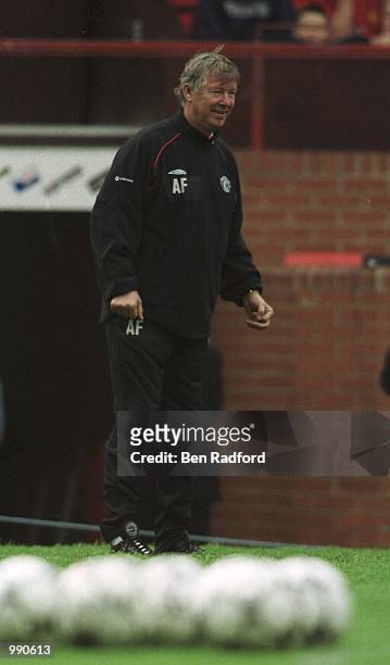 Alex Ferguson of Man Utd watches his players at training during the Manchester United Open day at Old Trafford, Manchester. Mandatory Credit: Ben...