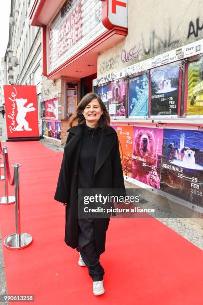 February 2018, Germany, Berlin, "Berlinale Goes Kiez", "Unga Astrid": The director Pernille Fischer Christensen stands in front of the cinema "Neues...