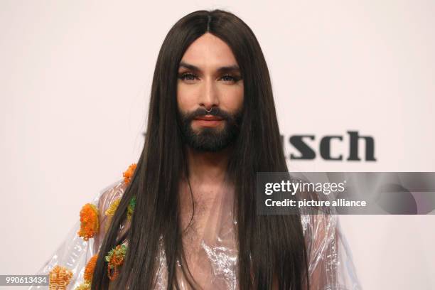 February 2018, Germany, Hamburg, Golden Camera Awards Ceremony: Austrian singer Conchita Wurst arrives on the red carpet. Photo: Georg Wendt/dpa