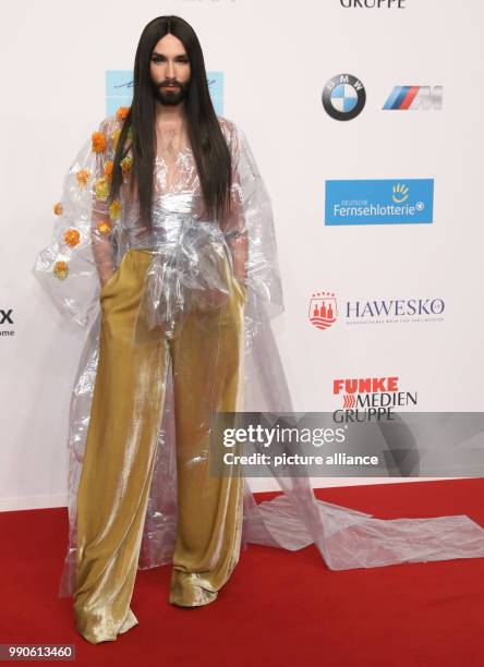 Dpatop - 22 February 2018, Germany, Hamburg, Golden Camera Awards Ceremony: Singer Conchita Wurst arrives on the red carpet. Photo: Georg Wendt/dpa