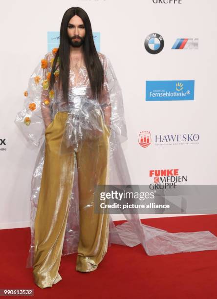 Conchita Wurst, stage persona of Austrian singer and drag queen Thomas Neuwirth, arrives at the 2017 Golden Camera Awards in Hamburg, Germany 22...