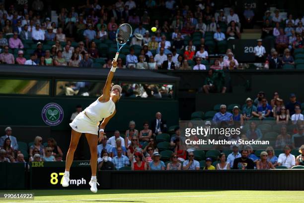 Garbine Muguruza of Spain serves against Naomi Broady of Great Britain during their Ladies' Singles first round match on day two of the Wimbledon...