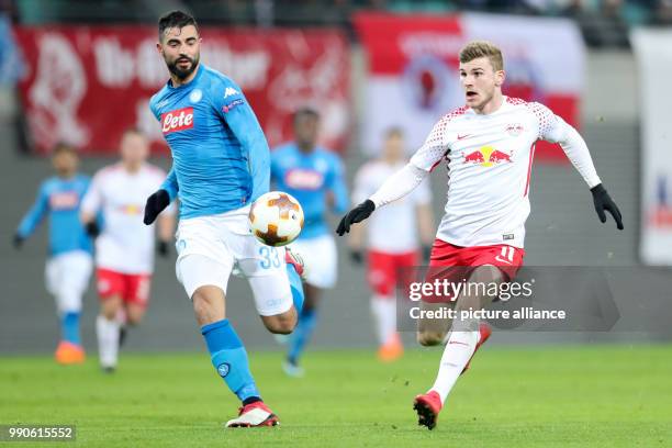 Leipzig's Timo Werner and Napoli's Raul Albiol vie for the ball during UEFA Europa League round of 32 second leg soccer match between RB Leipzig and...