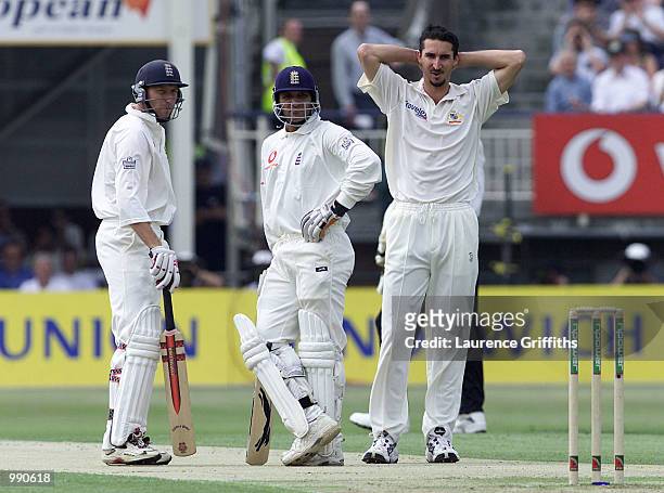 Mike Atherton and Mark Butcher of England in front of a frustrated Jason Gillespie of Australia during the opening day of the npower Ashes first test...